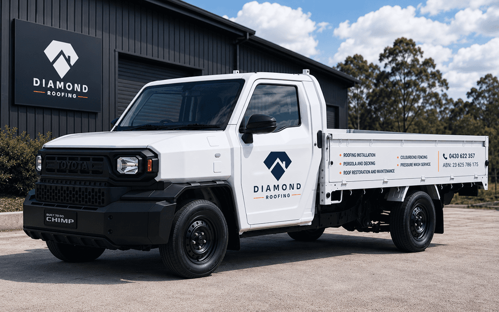 Diamond Roofing work truck and workshop signage in navy with the logo and service list
